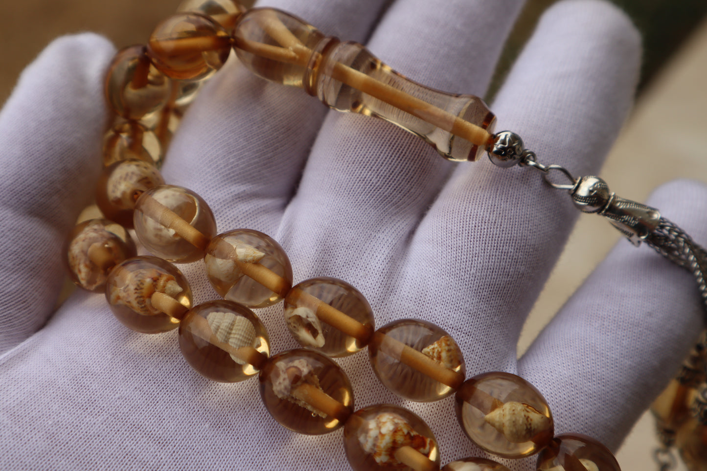 سبحه حجر تراب سندلوس بداخلها حلزون حقيقي