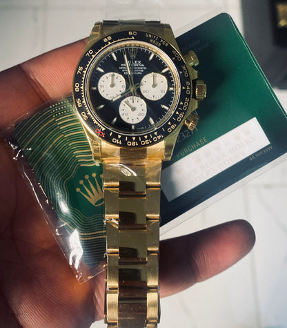 40 mm رولكس دايتونا ذهب أصفر بقرص أسود وسناتر بيضاء