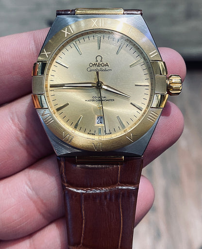 أوميجا كونستليشن ذهبي و جلد بني - كلين