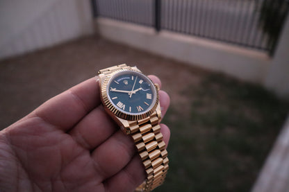 رولكس داي ديت يالو جولد ارقام روماني - الساعة كلين - مطابقة للاصلية - اللون طلاء عيار ١٨