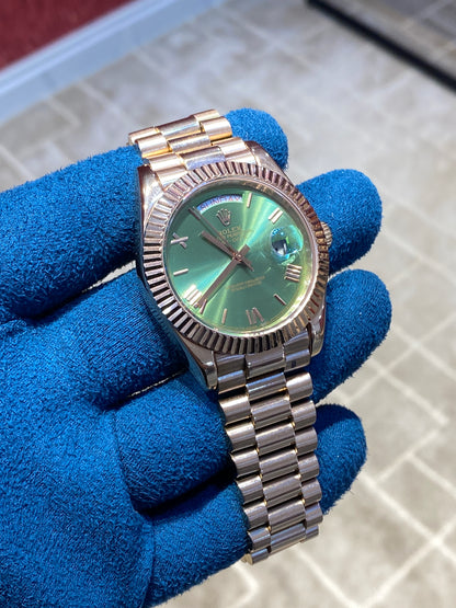 روليكس داي ديت فول روز جولد مينا زيتوني  - جراند ماستر ماكينة اوتوماتيك (قطعة واحدة)